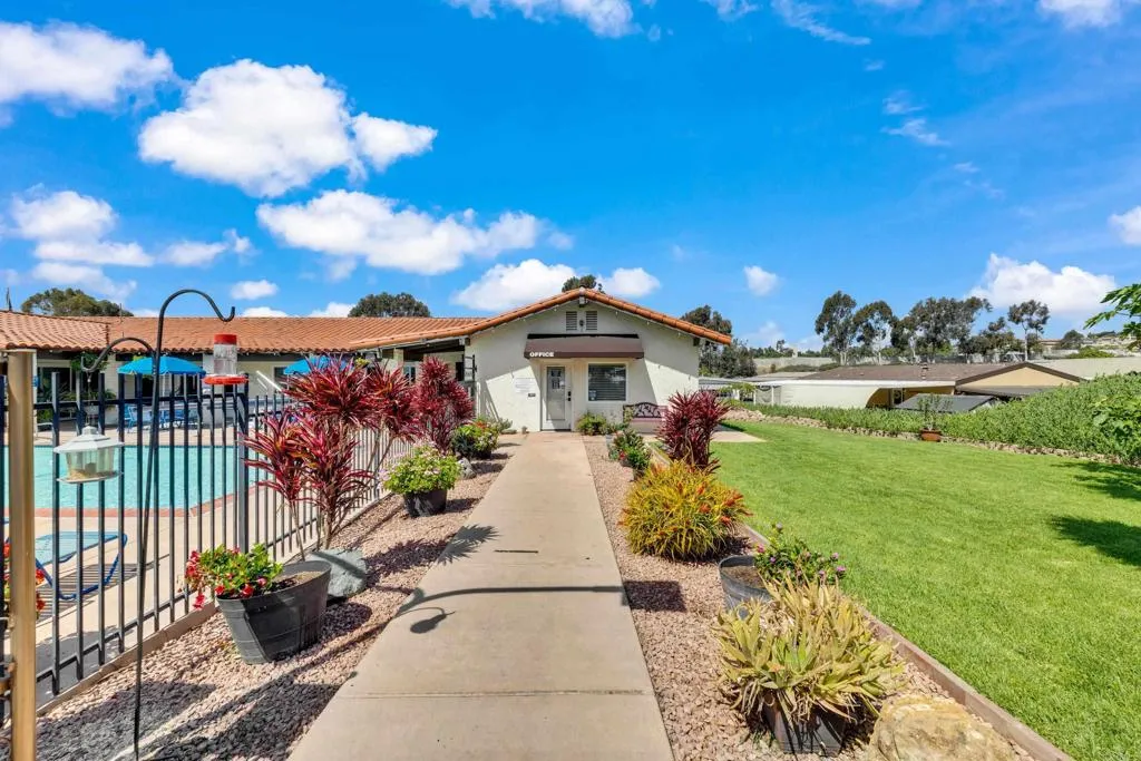 1815 Sweetwater Road, Unit 169 Spring Valley, CA 91977 - Photo 48 of 50 a view of a house with a garden and pathway