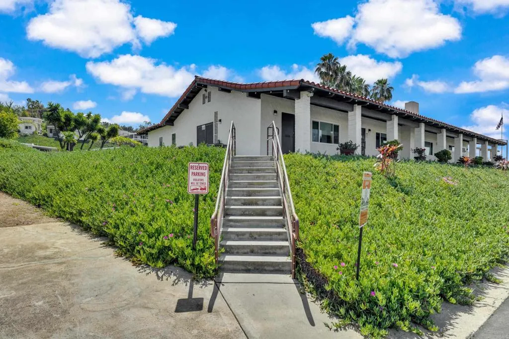 1815 Sweetwater Road, Unit 169 Spring Valley, CA 91977 - Photo 50 of 50 a view of a house with a small yard plants and large trees