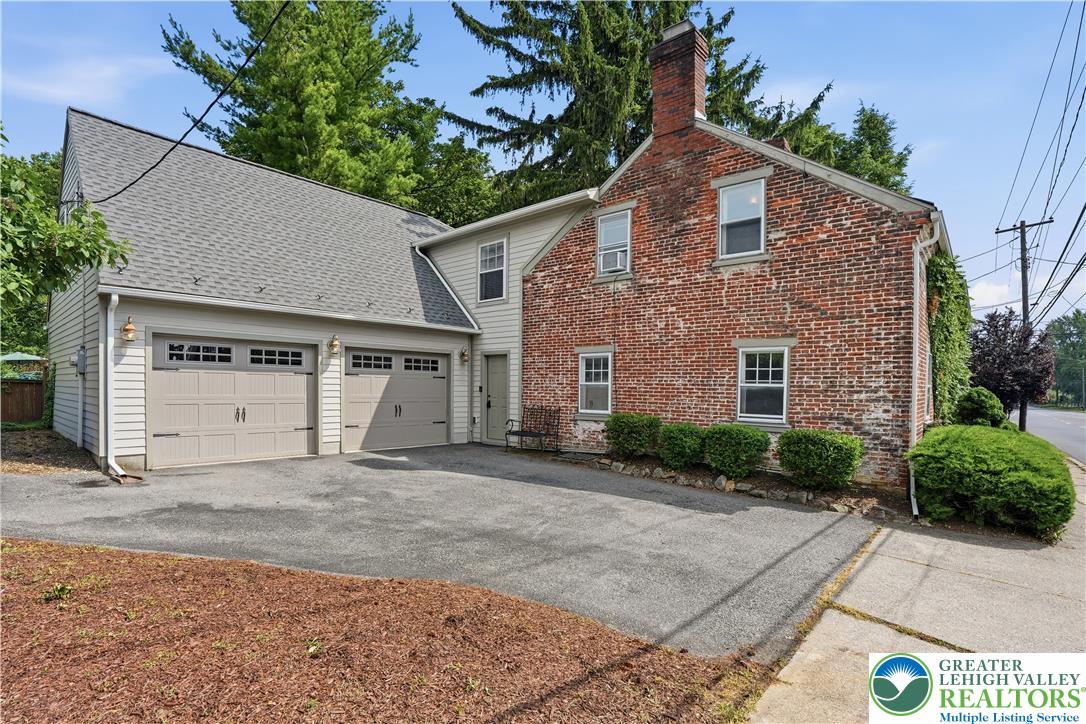 2014 Linden Street Bethlehem, PA 18017 - Photo 74 of 85 A classic brick exterior meets a modern garage addition in this inviting residential facade.