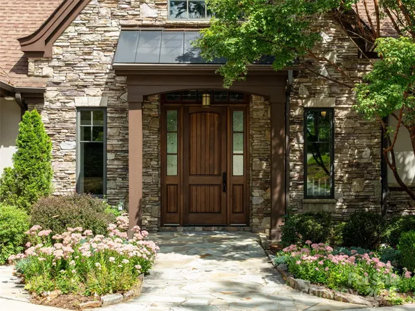 a front view of a house with garden