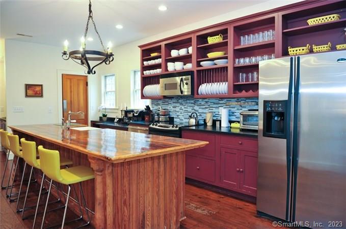 33 Sentry Hill Road Roxbury, CT 06783 - Photo 11 of 27 a kitchen with stainless steel appliances granite countertop a sink and a refrigerator