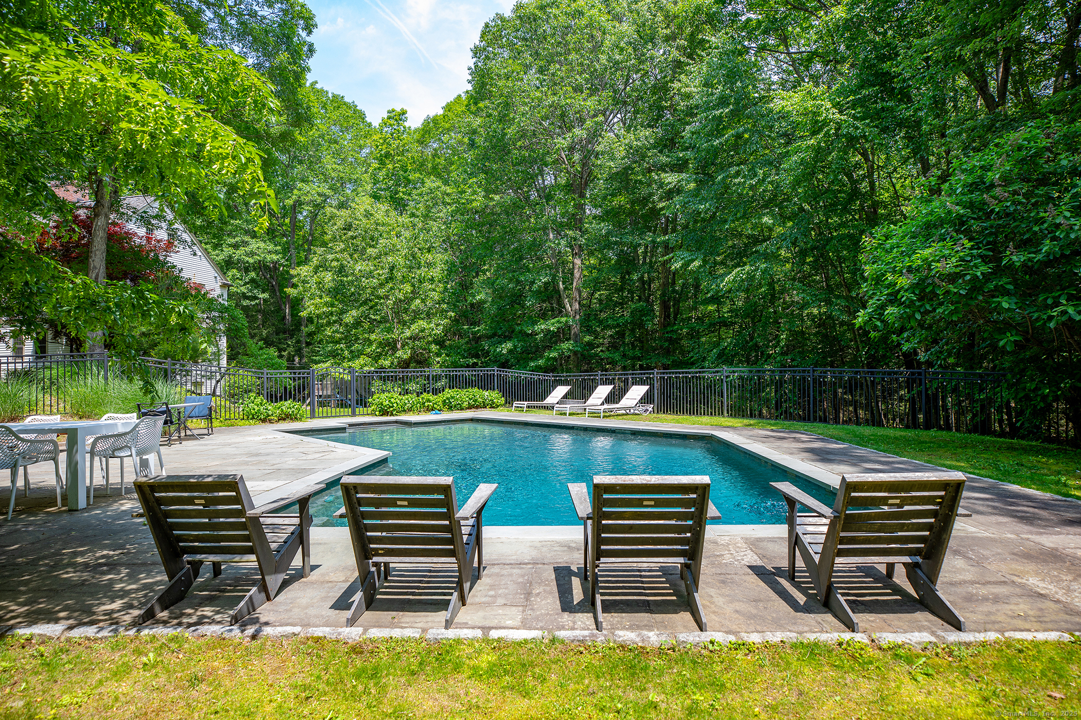 33 Sentry Hill Road Roxbury, CT 06783 - Photo 2 of 27 an outdoor sitting area with chairs and a table
