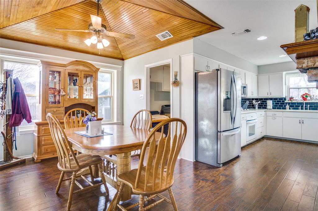 10124 Wandering Way Street Benbrook, TX 76126 - Photo 1 of 23 a view of a dining room with furniture and wooden floor
