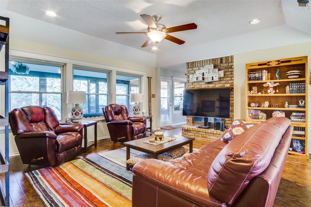 10124 Wandering Way Street Benbrook, TX 76126 - Photo 3 of 23 a living room with furniture a flat screen tv and a large window