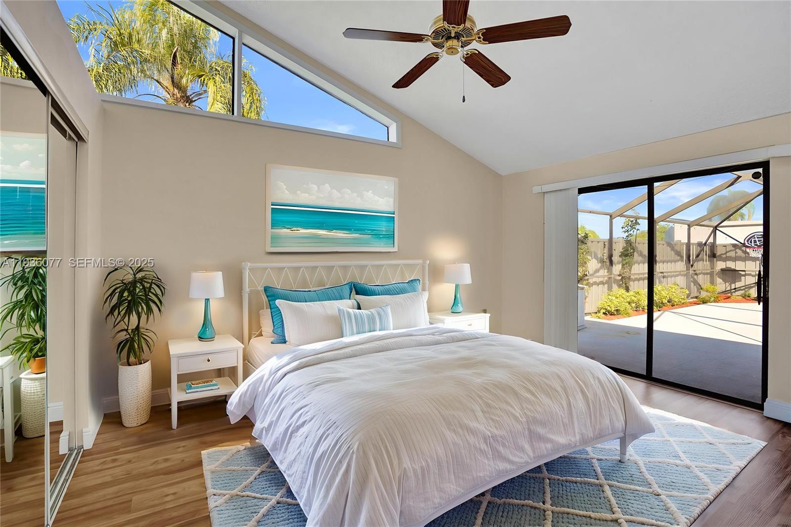 9569 Boca Gardens Parkway, Unit B Boca Raton, FL 33496 - Photo 13 of 40 a spacious bedroom with a large bed and a window
