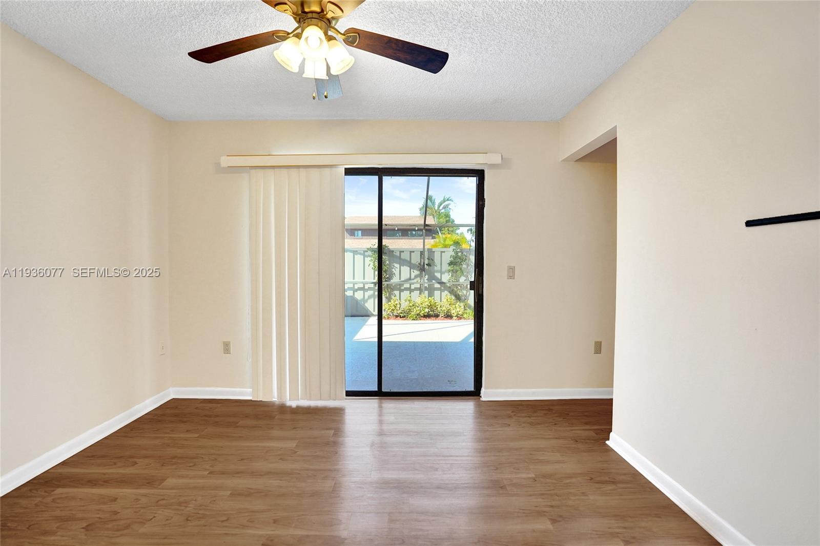 9569 Boca Gardens Parkway, Unit B Boca Raton, FL 33496 - Photo 18 of 40 an empty room with wooden floor and windows