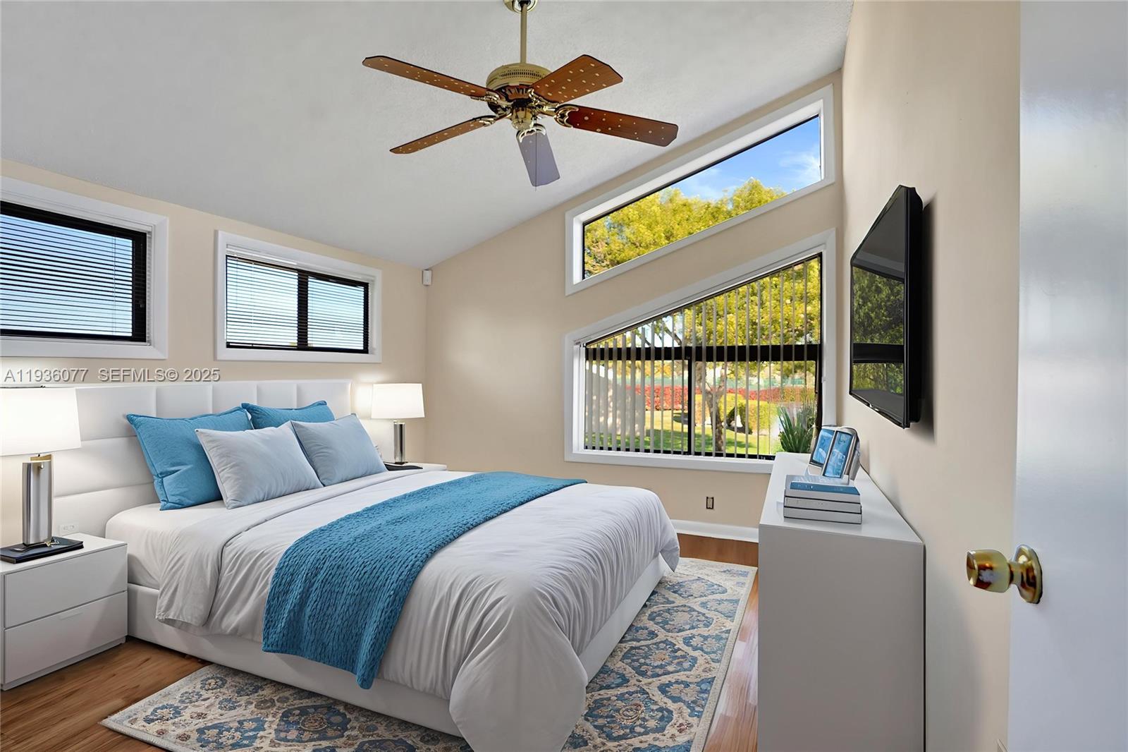 9569 Boca Gardens Parkway, Unit B Boca Raton, FL 33496 - Photo 23 of 40 a bedroom with a bed and a window