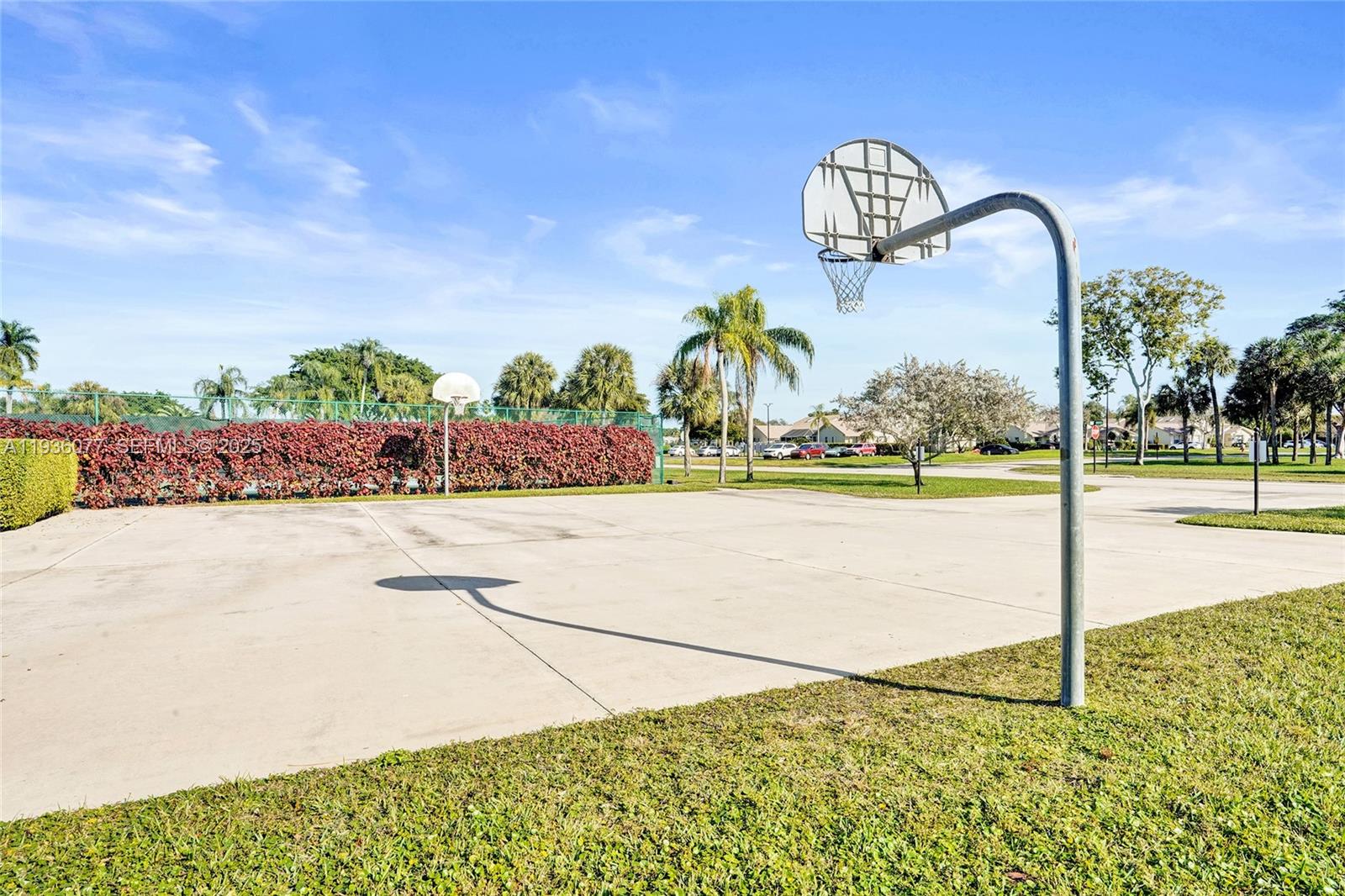 9569 Boca Gardens Parkway, Unit B Boca Raton, FL 33496 - Photo 30 of 40 a front view of a building with garden