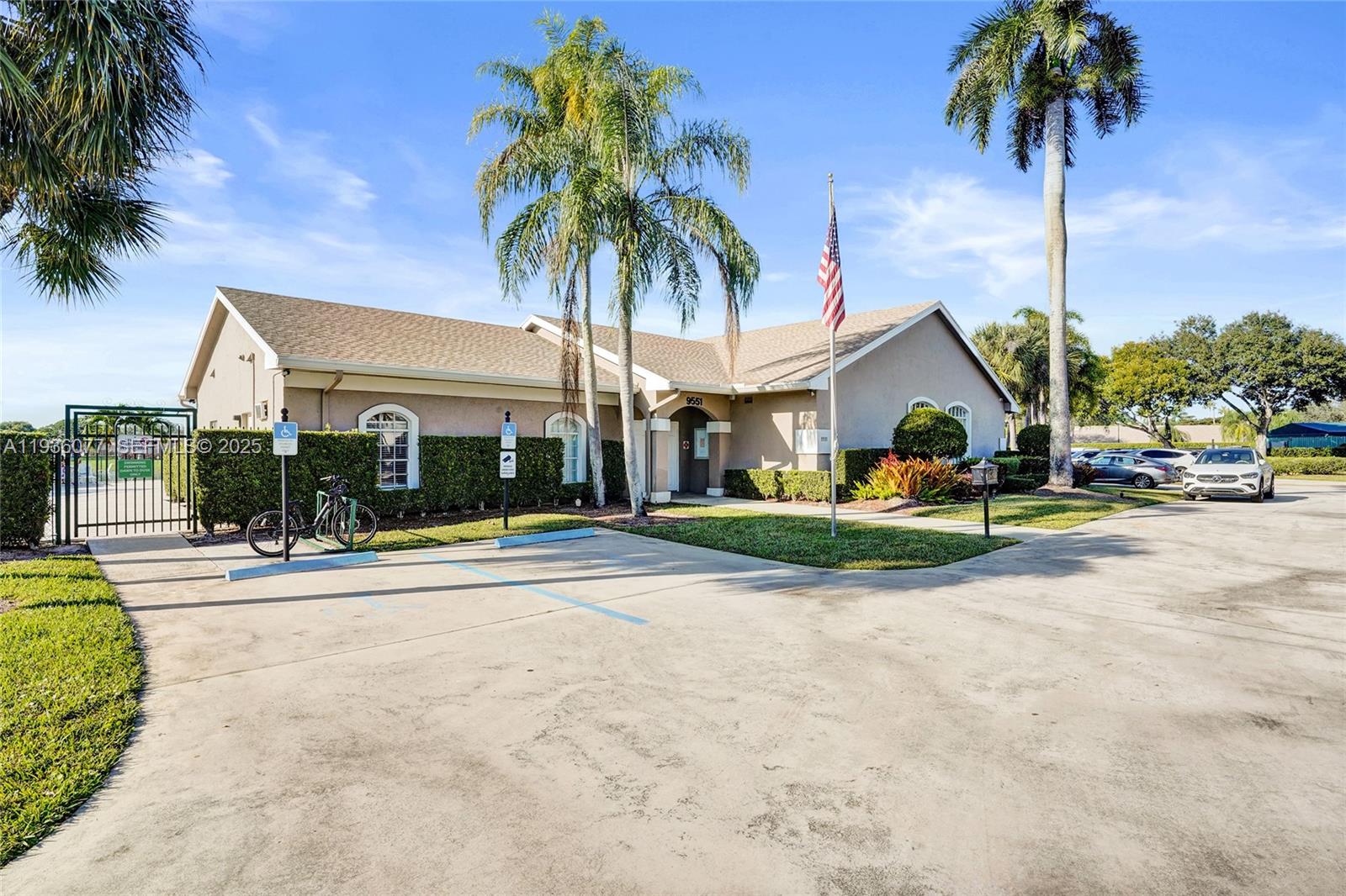 9569 Boca Gardens Parkway, Unit B Boca Raton, FL 33496 - Photo 32 of 40 a view of a swimming pool with palm trees