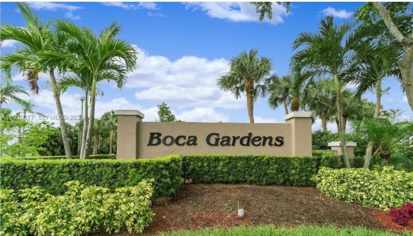 9569 Boca Gardens Parkway, Unit B Boca Raton, FL 33496 - Photo 4 of 40 a sign that is sitting in front of a house