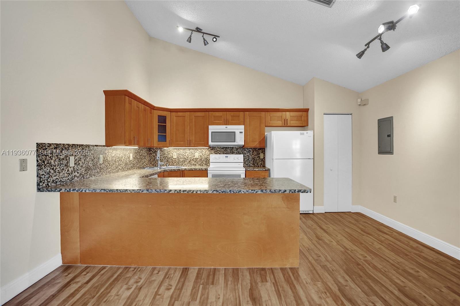 9569 Boca Gardens Parkway, Unit B Boca Raton, FL 33496 - Photo 10 of 40 a view of kitchen with cabinets and wooden floor