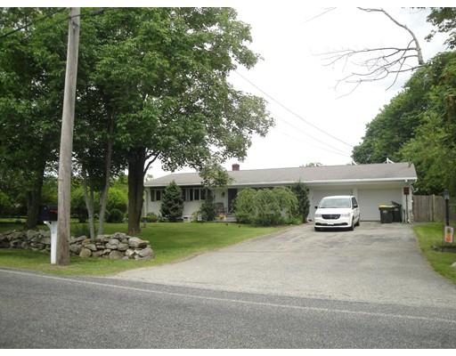 a view of a car park side of a road