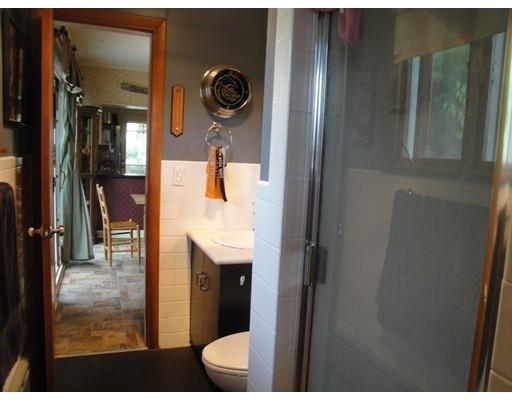 104 Forge Road Westport, MA 02790 - Photo 11 of 17 a bathroom with a sink and mirror