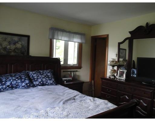 104 Forge Road Westport, MA 02790 - Photo 12 of 17 a bedroom with a bed and a flat screen tv