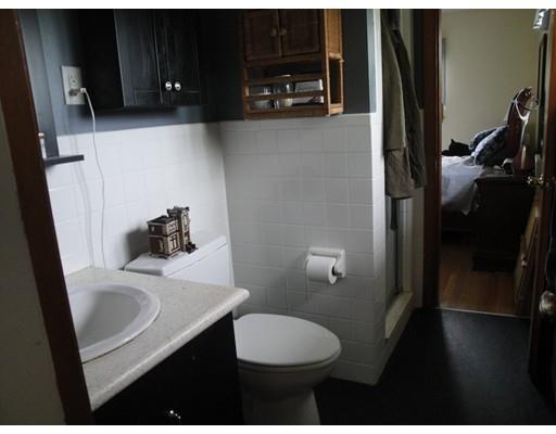 104 Forge Road Westport, MA 02790 - Photo 14 of 17 a bathroom with a sink a toilet a vanity and mirror