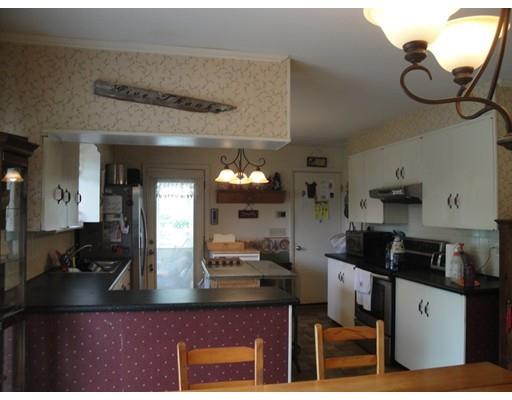104 Forge Road Westport, MA 02790 - Photo 4 of 17 a kitchen with stainless steel appliances granite countertop a sink and a stove