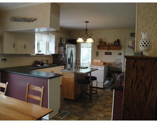 104 Forge Road Westport, MA 02790 - Photo 5 of 17 a kitchen with a sink cabinets and wooden floor