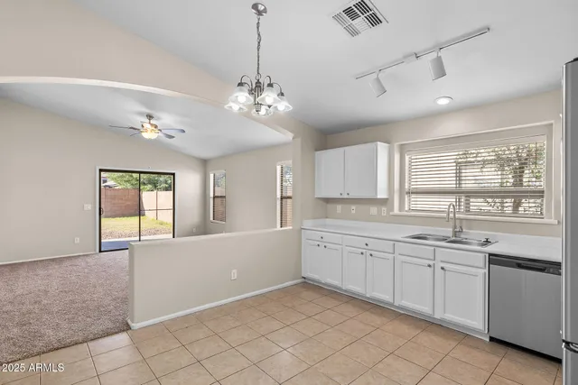 a bathroom with a sink and mirror with toilet