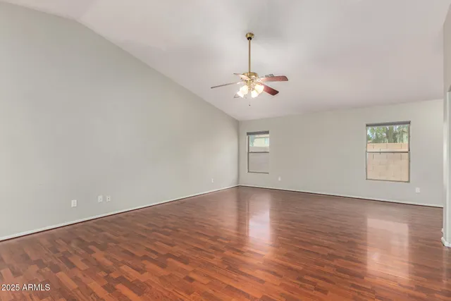 a kitchen with stainless steel appliances granite countertop a sink a stove and refrigerator