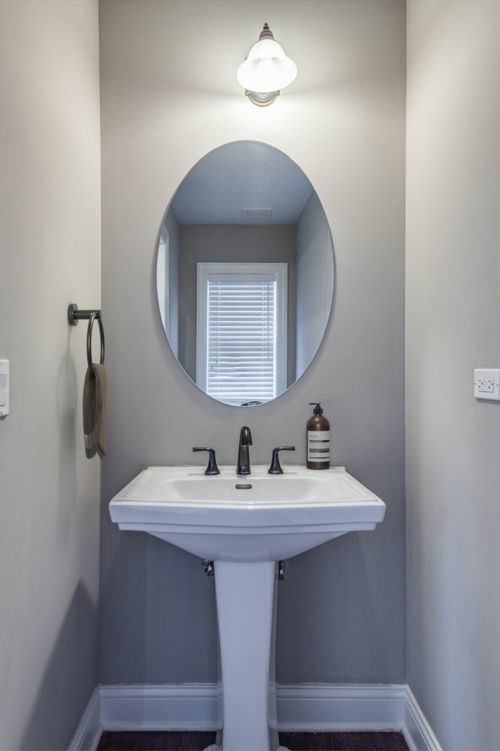 241 North Northwest Highway Park Ridge, IL 60068 - Photo 19 of 28 a bathroom with a sink and a mirror