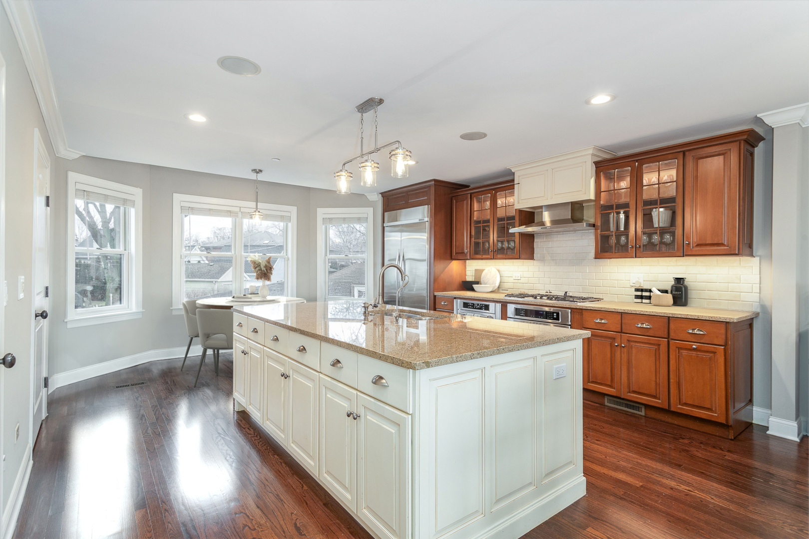 241 North Northwest Highway Park Ridge, IL 60068 - Photo 10 of 28 a kitchen with stainless steel appliances granite countertop a sink stove and wooden floor