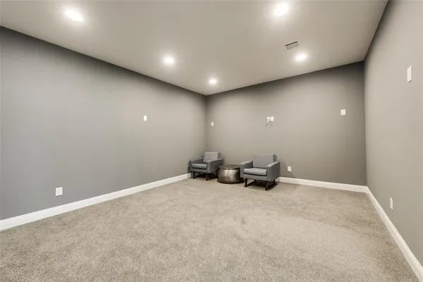 an empty room with furniture and windows