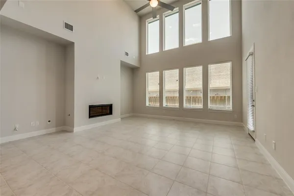 a view of an empty room with a fireplace