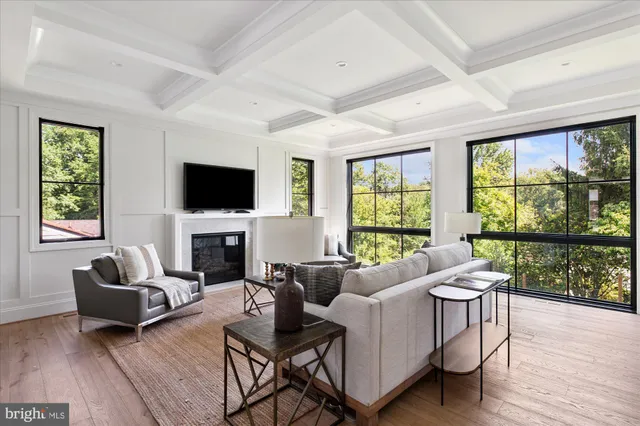 a kitchen with a dining table chairs stove and cabinets