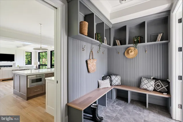 a bedroom with a large bed and windows