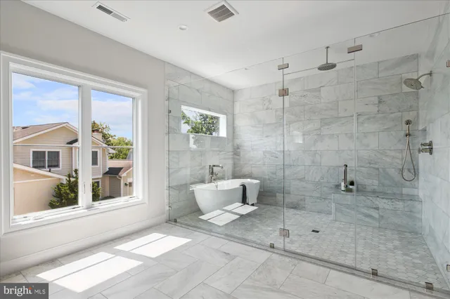 a view of cabinets a sink and a stove in a room