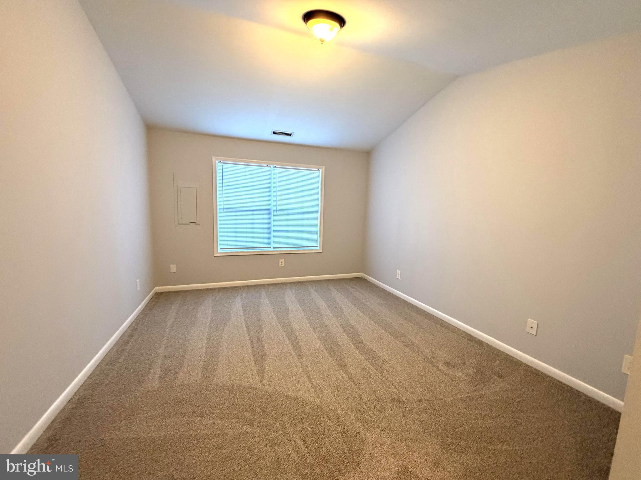 660 Ripplebrook Drive Culpeper, VA 22701 - Photo 17 of 19 an empty room with wooden floor and windows
