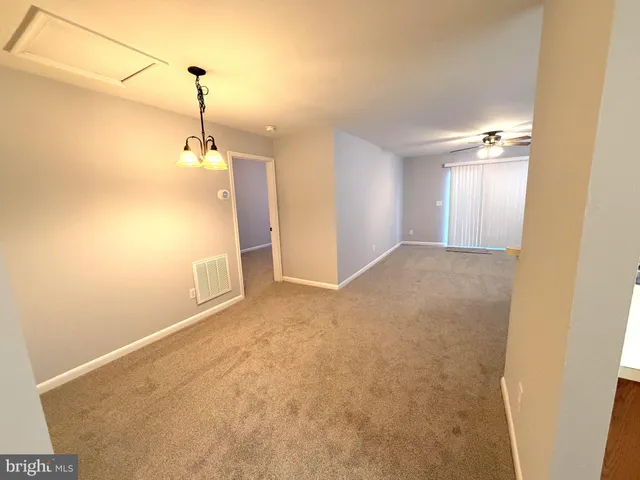 a view of empty room with windows