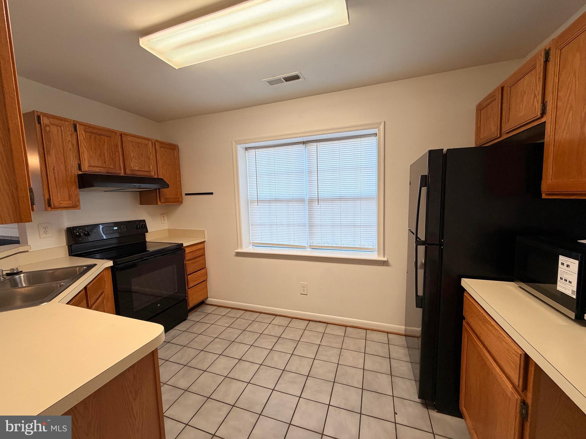 660 Ripplebrook Drive Culpeper, VA 22701 - Photo 4 of 19 a kitchen with a sink a stove and refrigerator
