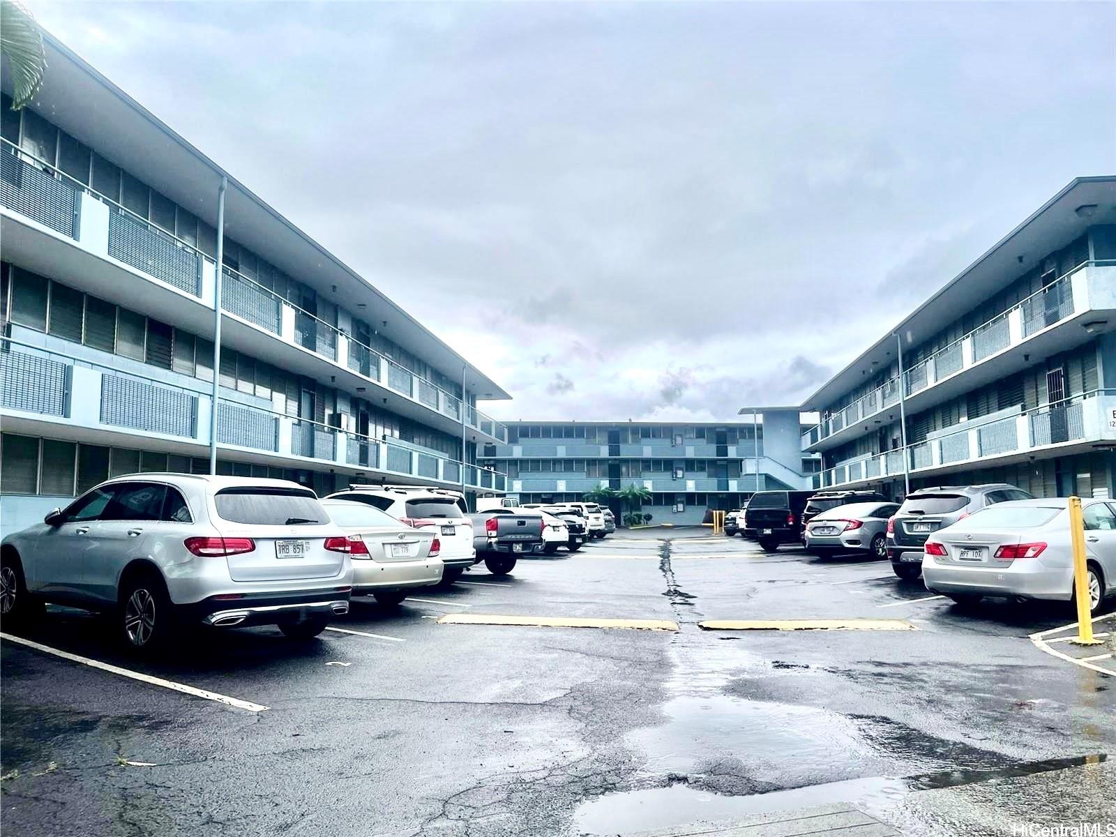 a view of a cars parked in front of a building