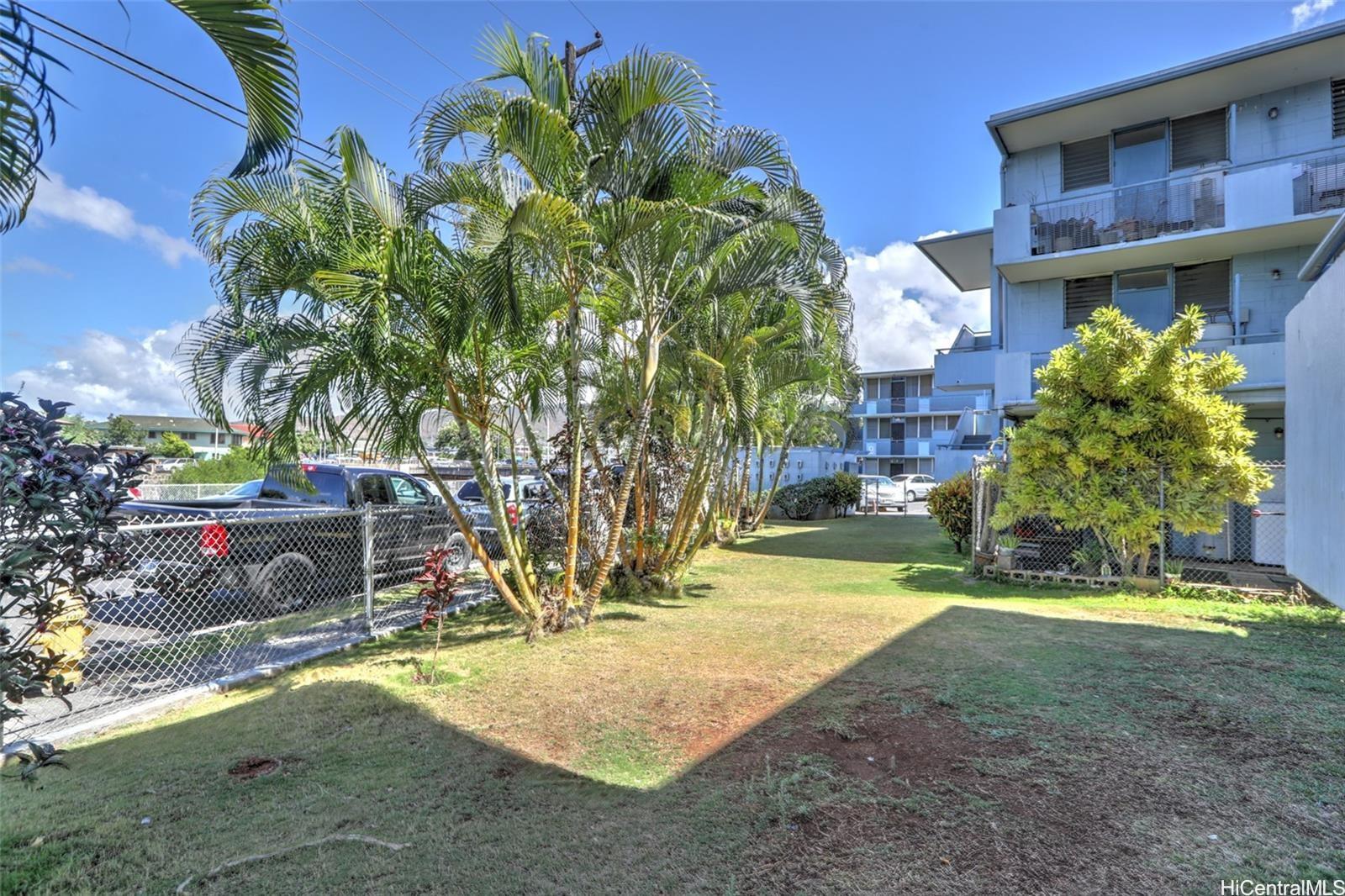 1209 Kokea Street, Unit F203 Honolulu, HI 96817 - Photo 13 of 14 a view of a yard with plants