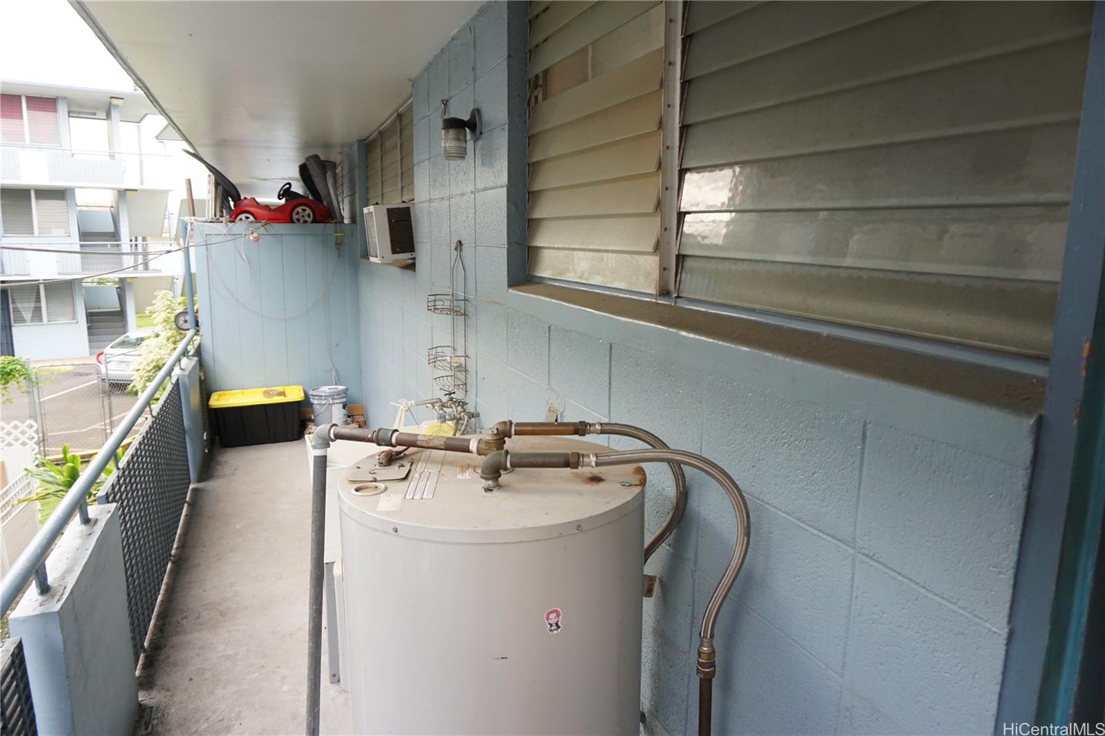 1209 Kokea Street, Unit F203 Honolulu, HI 96817 - Photo 4 of 14 a utility room with dryer and washer