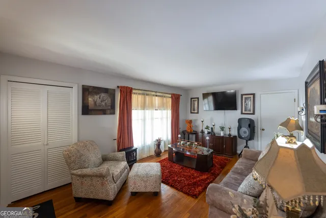 a living room with furniture and a window