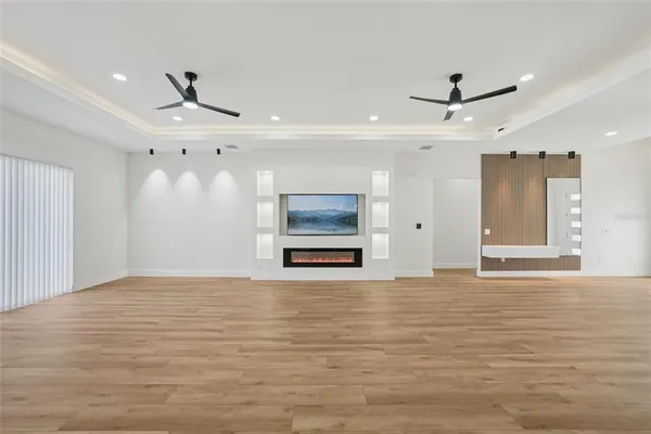 a large kitchen with stainless steel appliances kitchen island granite countertop a sink and cabinets