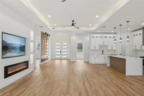 a large kitchen with stainless steel appliances kitchen island granite countertop a sink and cabinets