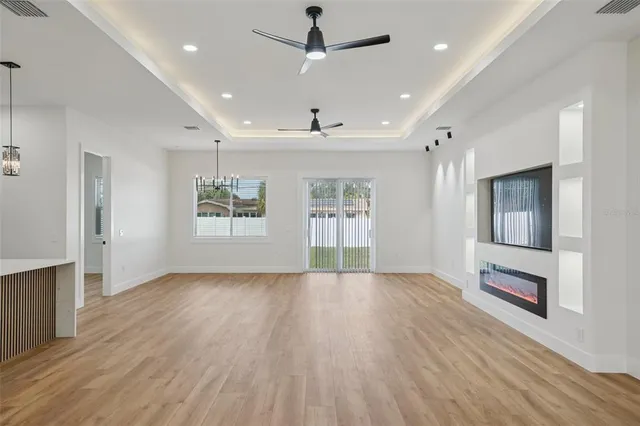 a spacious bathroom with a shower sink mirror and