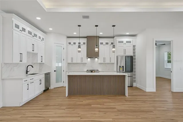 a bathroom with a double vanity sink mirror and shower