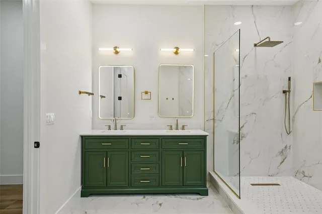 an aerial view of residential houses with outdoor space and city view