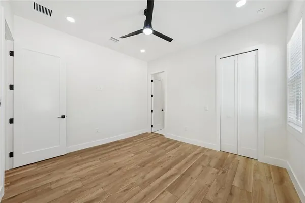 an aerial view of residential houses with outdoor space and swimming pool