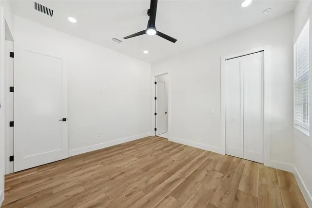 an aerial view of residential houses with outdoor space and swimming pool