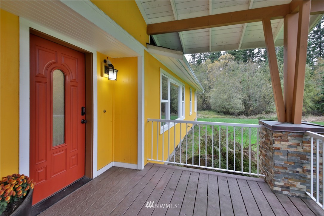 6416 Wahl Road Freeland, WA 98249 - Photo 3 of 40 a view of a porch with wooden floor and outdoor space