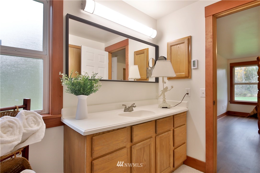 6416 Wahl Road Freeland, WA 98249 - Photo 21 of 40 a bathroom with a sink and a mirror