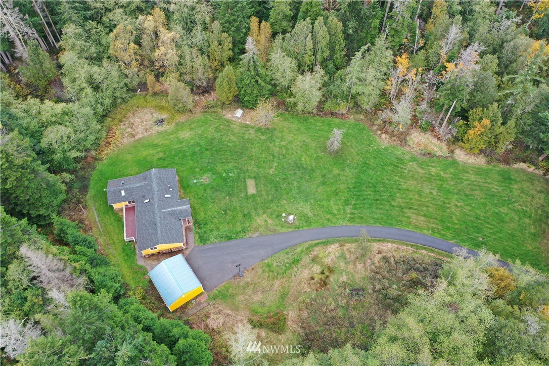 6416 Wahl Road Freeland, WA 98249 - Photo 32 of 40 an aerial view of a house with a yard