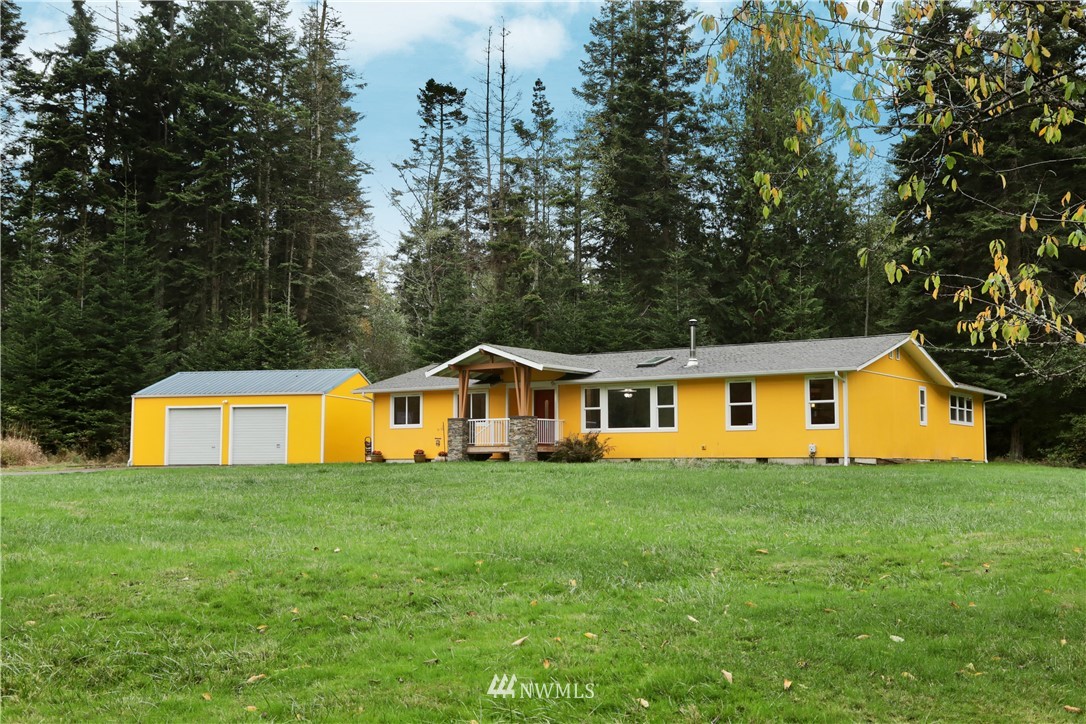6416 Wahl Road Freeland, WA 98249 - Photo 36 of 40 a view of a house with yard and trees in the background