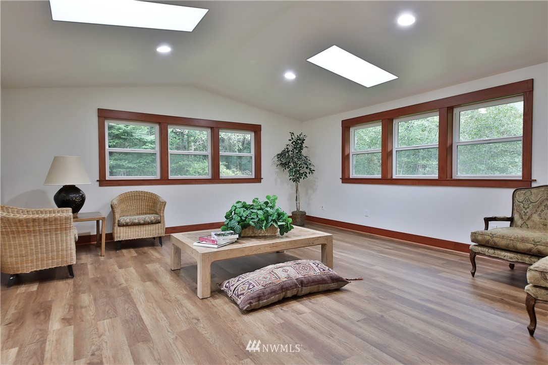 6416 Wahl Road Freeland, WA 98249 - Photo 10 of 40 a living room with furniture and a large window