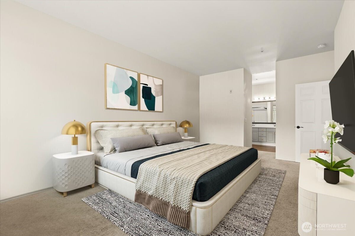17426 Bothell Way Northeast, Unit A302 Bothell, WA 98011 - Photo 20 of 40 a spacious bedroom with a bed and a couch